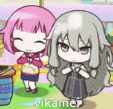 a couple of anime girls are standing next to each other and one of them is named vikamei .