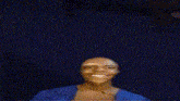 a man with a surprised look on his face is standing in front of a purple and blue background