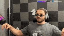 a man wearing sunglasses and headphones says chess is calling