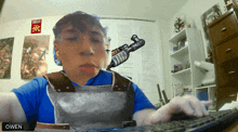 a picture of a person with the name owen in the corner