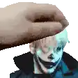 a hand is touching a clown 's head in a pixelated image .