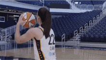a female basketball player with the number 22 on the back of her jersey