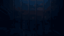 a statue of a woman with wings is standing on a roof in the dark