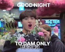 a man holding flowers with the words good night to dam only written below him