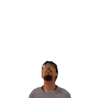 a man with glasses and a beard is looking up at the number 14