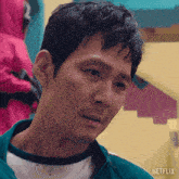 a close up of a man 's face with the word netflix on the bottom right