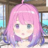 a close up of a girl 's face with pink and purple hair
