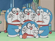 a group of doraemon cartoon characters with their faces drawn on them
