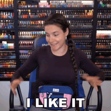 a woman sitting on an exercise bike with a bag on her waist that says i like it
