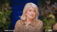 a woman in a sequined jacket is on nbc yes chef