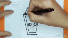 a person is drawing a coffin with a face on a piece of paper made in animatica
