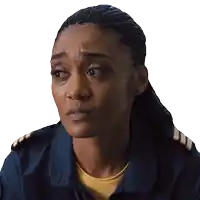 a close up of a woman 's face with a yellow shirt