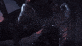 a knight in armor is holding a sword in his right hand