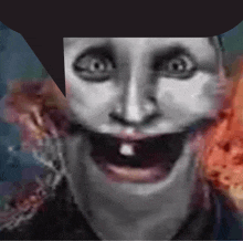 a close up of a person 's face with a big smile