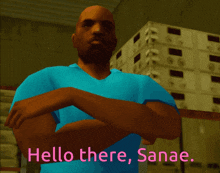 a man in a blue shirt is standing in front of a stack of boxes and says hello there sanag