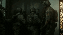 a group of soldiers standing in front of a door