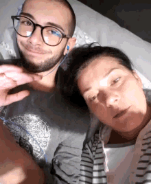 a man and a woman are posing for a picture