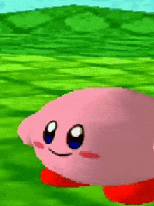 a pink kirby cartoon character is walking on a green field in a video game .