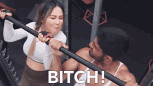 a man and a woman in a gym with the word bitch on the bottom right