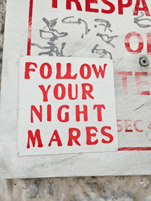 a sign that says follow your night mares in red