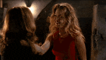a woman in a red top is asking another woman " can you fly "