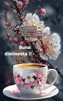 a cup of coffee sits on a saucer next to a branch of flowers with the words " buna dimineata " below it