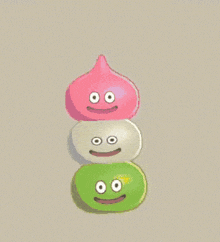 three cartoon characters are stacked on top of each other with smiley faces on their faces