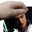 a hand is putting a hat on a man 's head in a pixelated image .