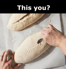 a person is cutting a loaf of bread with a knife and the words " this you " behind them