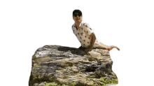 posing eric nam balancing on the rock looking around