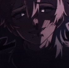 a close up of a person 's face with their eyes glowing in the dark