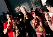 a group of people are eating ice cream and drinking soda