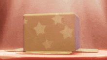 a cardboard box with yellow stars on it
