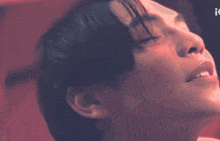 a close up of a man 's face with the letter i visible