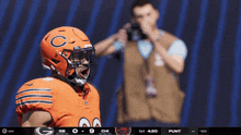a football player wearing a helmet with a c on it