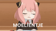 a girl with pink hair is sitting at a desk with the word moelietje on the bottom right