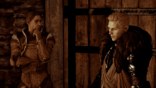 two men are standing next to each other and one of them is wearing a feathered coat