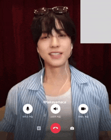 a man wearing sunglasses is talking on a video call with the name takayamaca