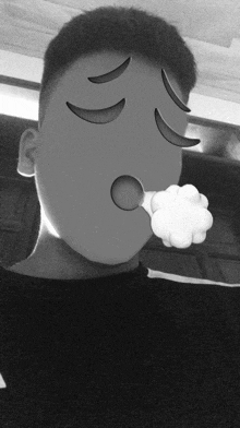 a black and white photo of a person with an emoji face