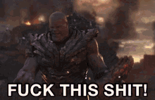 thanos from avengers endgame is holding a glove with the words fuck this shit below him