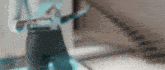 a blurry picture of a person 's torso with a staircase in the background