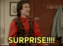 a man in a red shirt and vest is holding his mouth open and saying surprise !!!