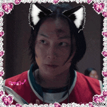 a picture of a man with cat ears and a pink frame