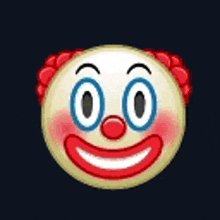 a clown smiley face with red hair and a hand pointing at its nose .