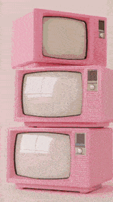 three pink televisions stacked on top of each other with a rainbow colored screen