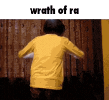 a person in a yellow shirt is dancing in front of a curtain with the words wrath of ra above them