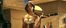 a woman with a necklace around her neck stands in front of a statue