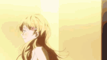 a girl with long blonde hair and a flower in her hair is standing in front of a wall .