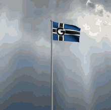 a blue and black flag with a g on it