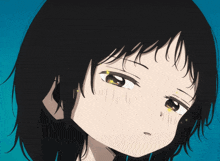 a close up of a girl 's face with a tear coming out of her eye